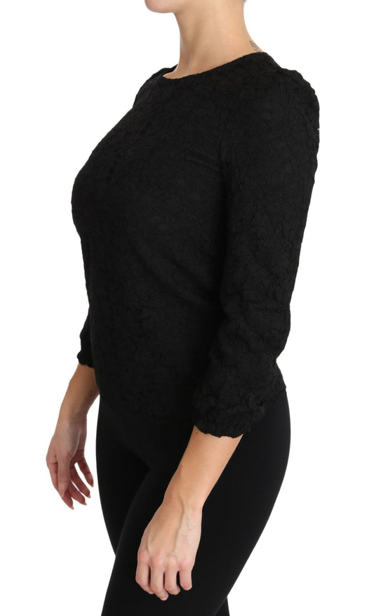 Black long sleeve top with ruffled shoulders