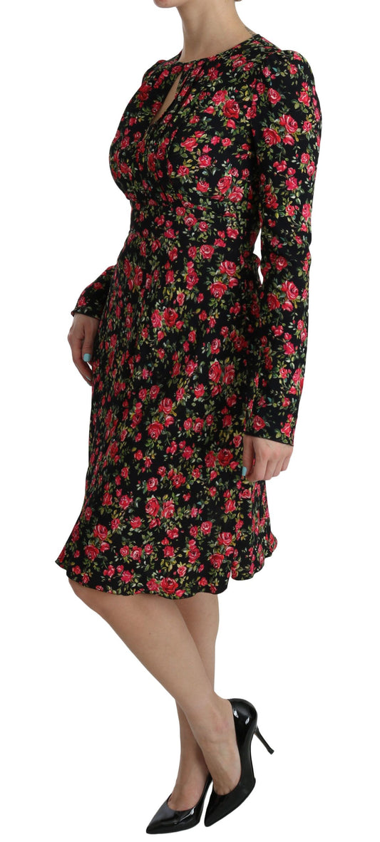 A black floral knee length dress with long sleeves
