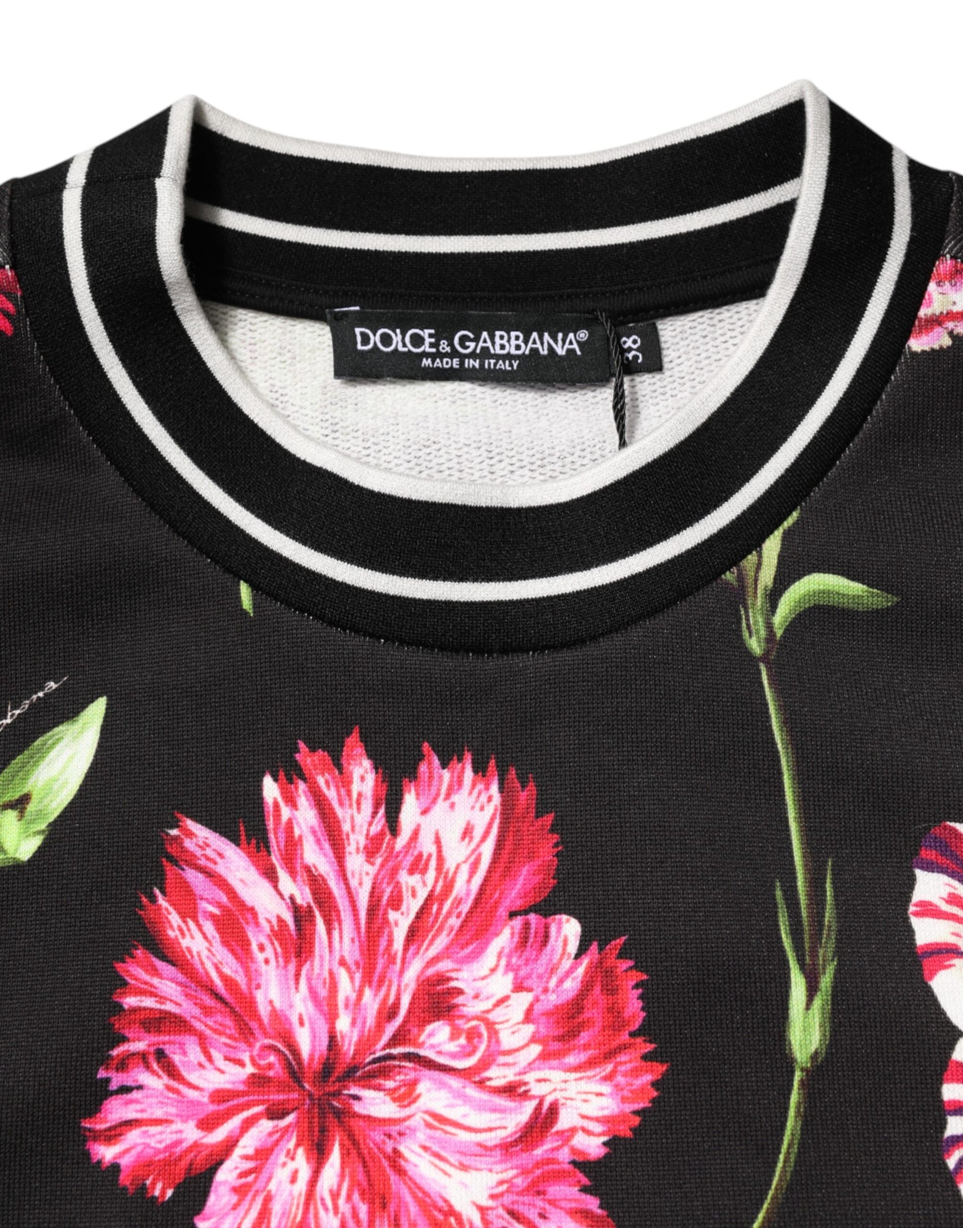 Black sweater with floral pattern on front