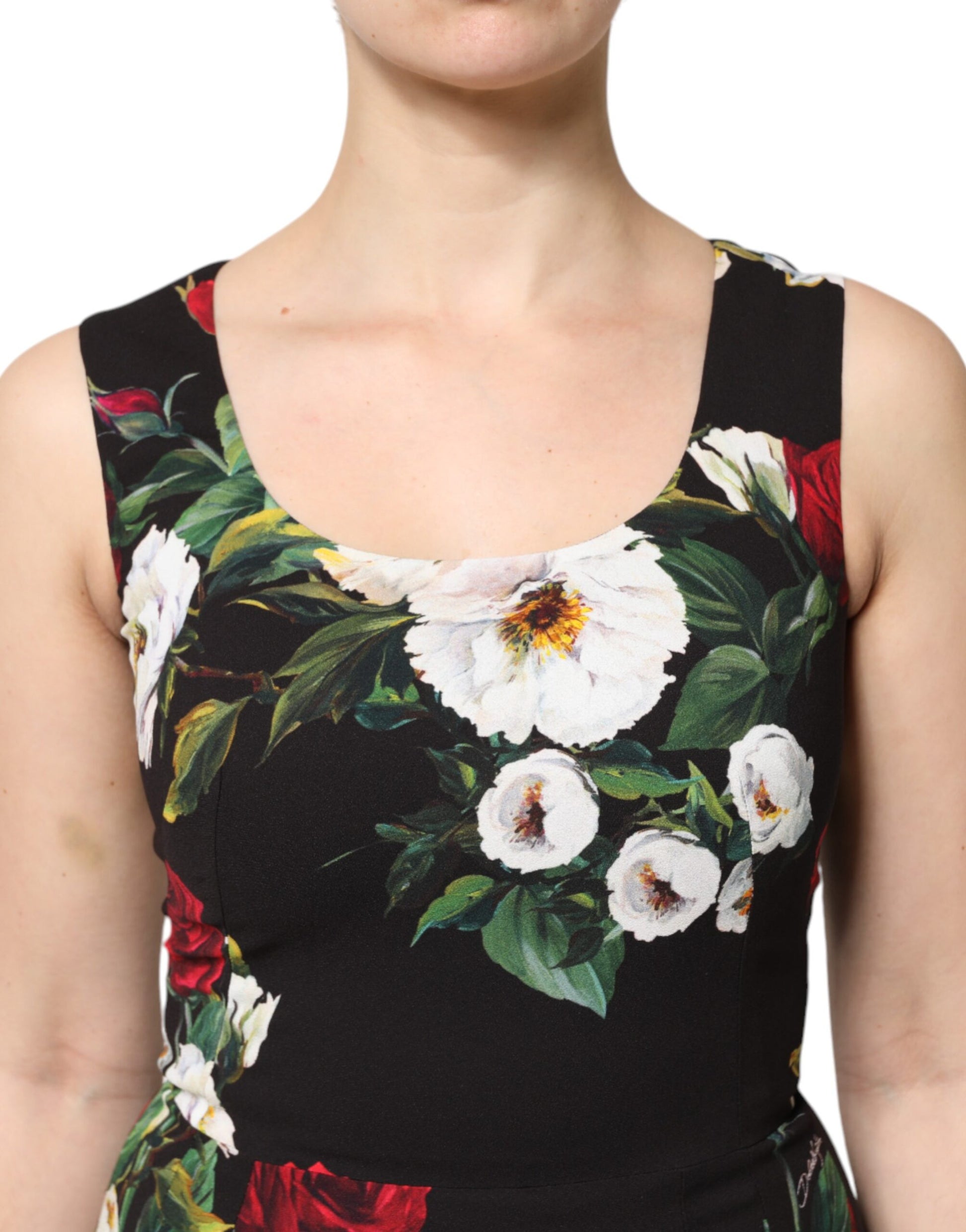 A sleeveless black dress with floral print and white flowers