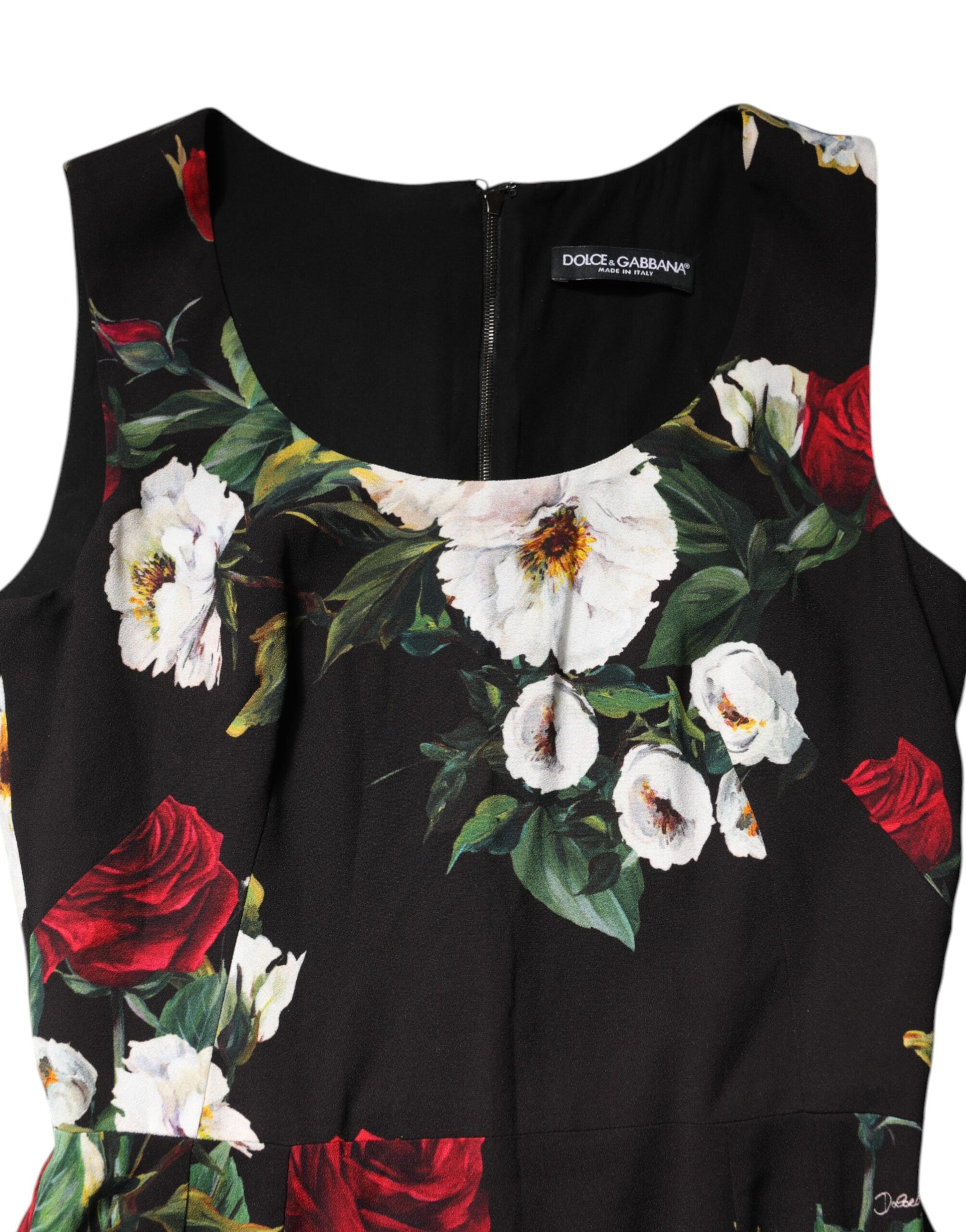 A black sleeveless dress with a floral print featuring red and white flowers