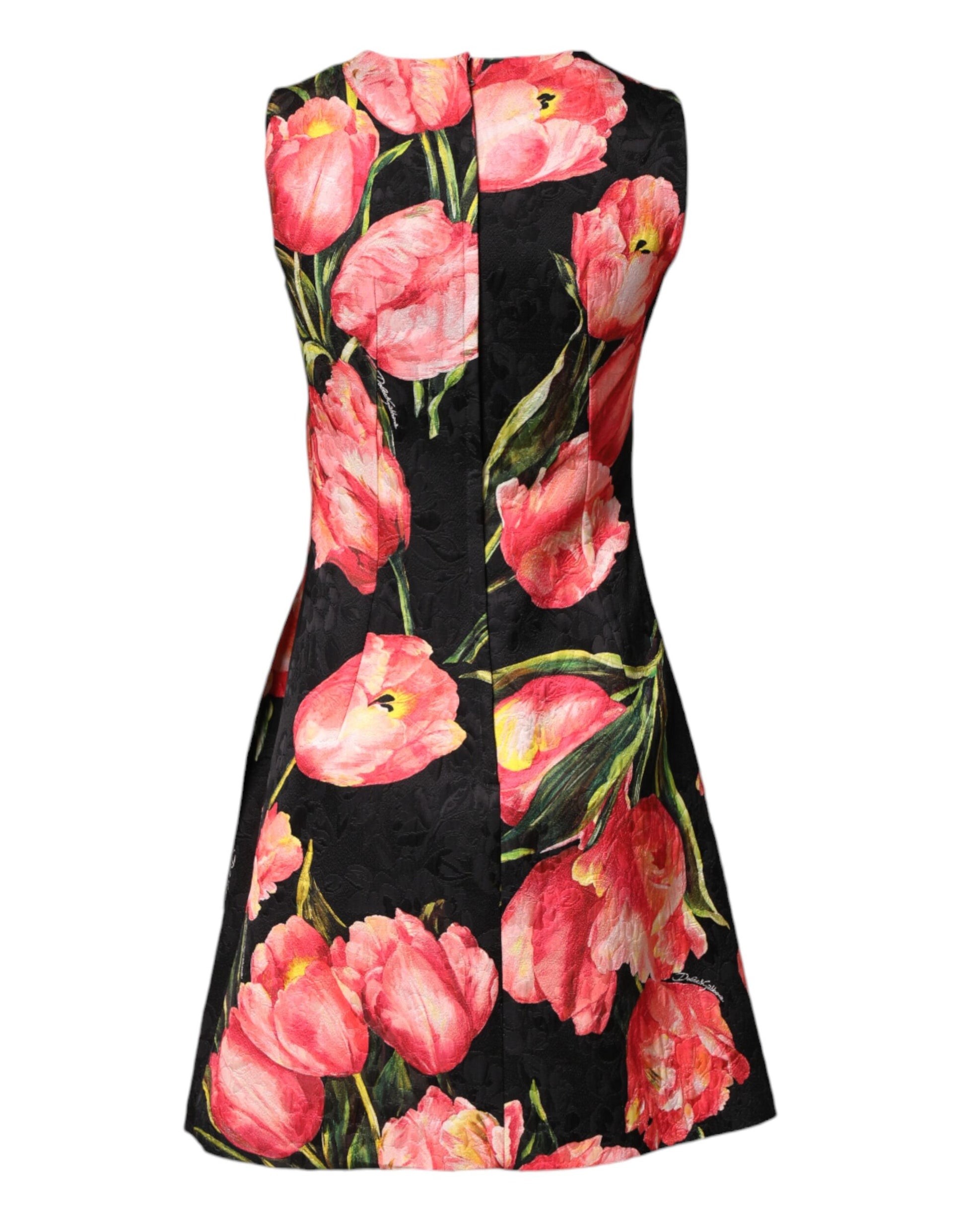 A black dress with a floral print featuring red flowers. It is made of viscose material and has an A-line sil