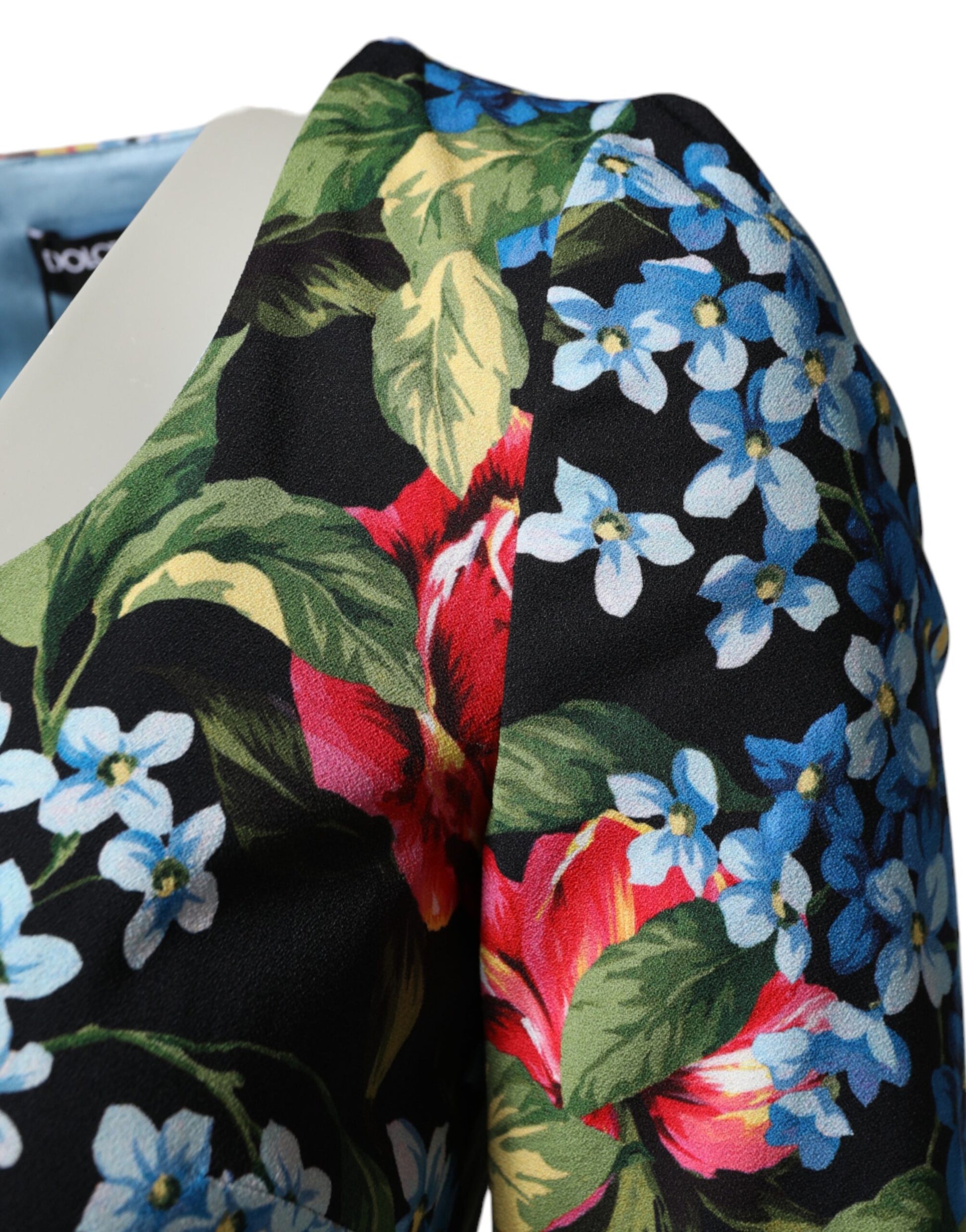 A black floral print midi dress with a viscose fabric