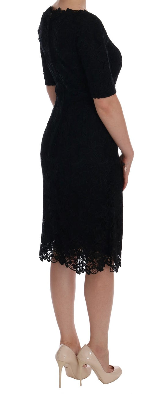 Woman wearing black dress with lace detailing