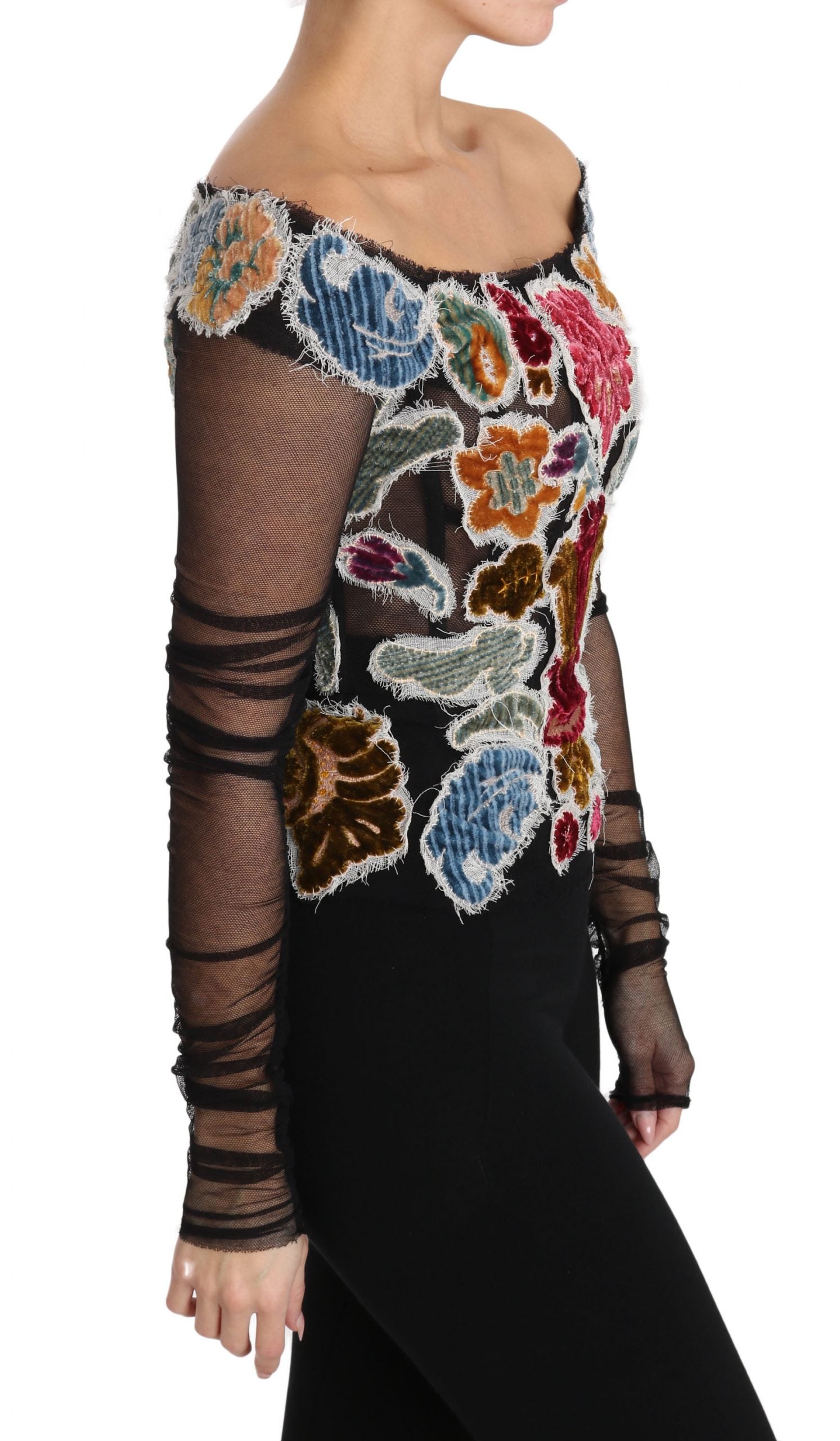 Woman wearing a long sleeve top with floral embroidery