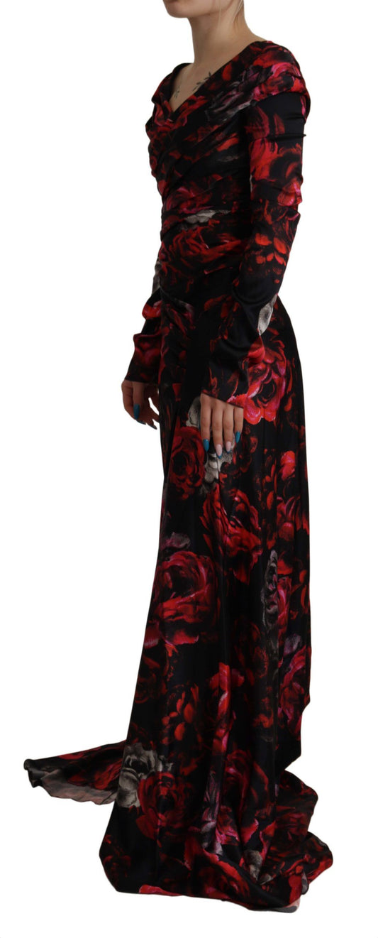Long black dress with floral pattern, sleeveless, fitted at the waist and flared towards the bottom