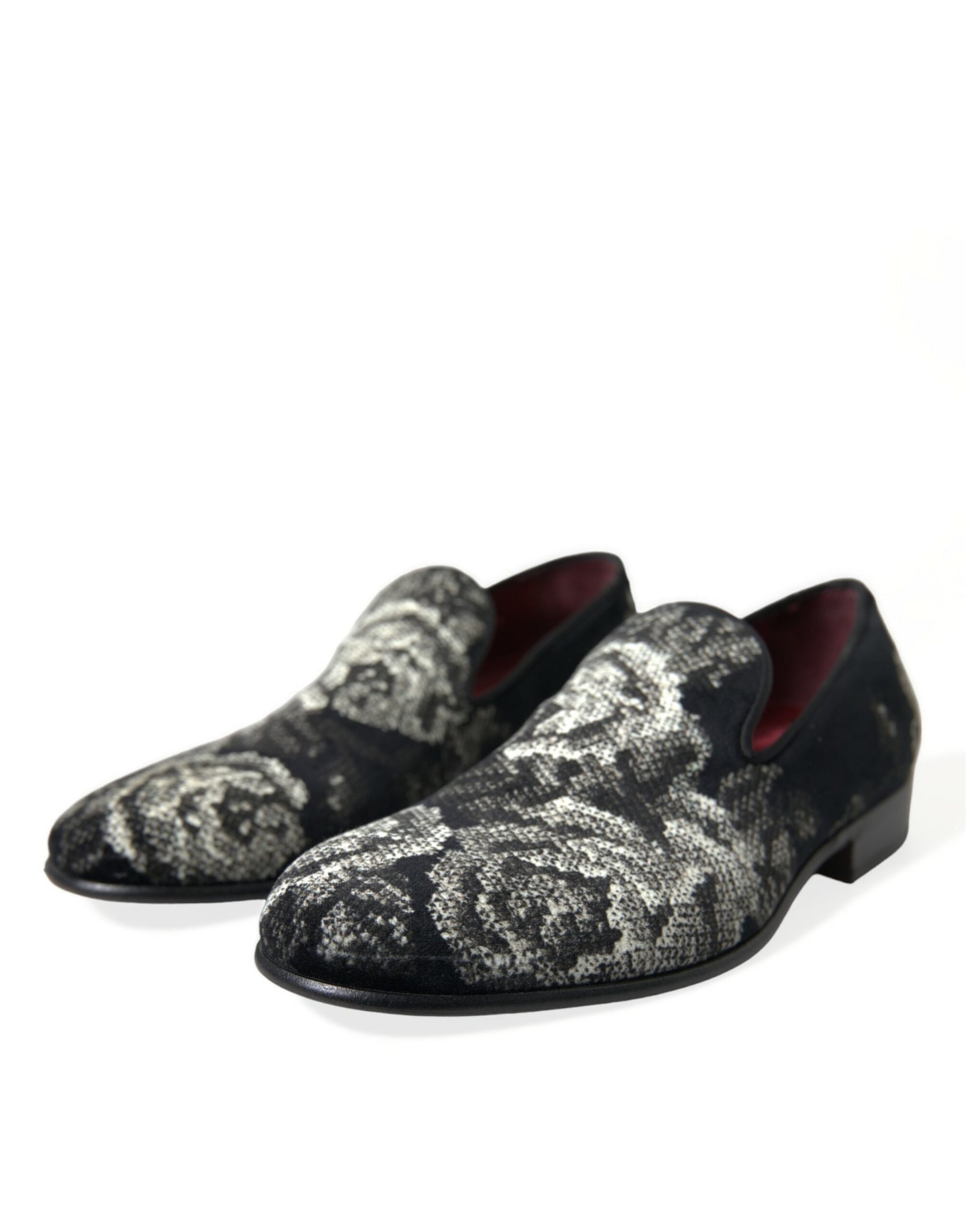Pair of black shoes with patterned designs on top