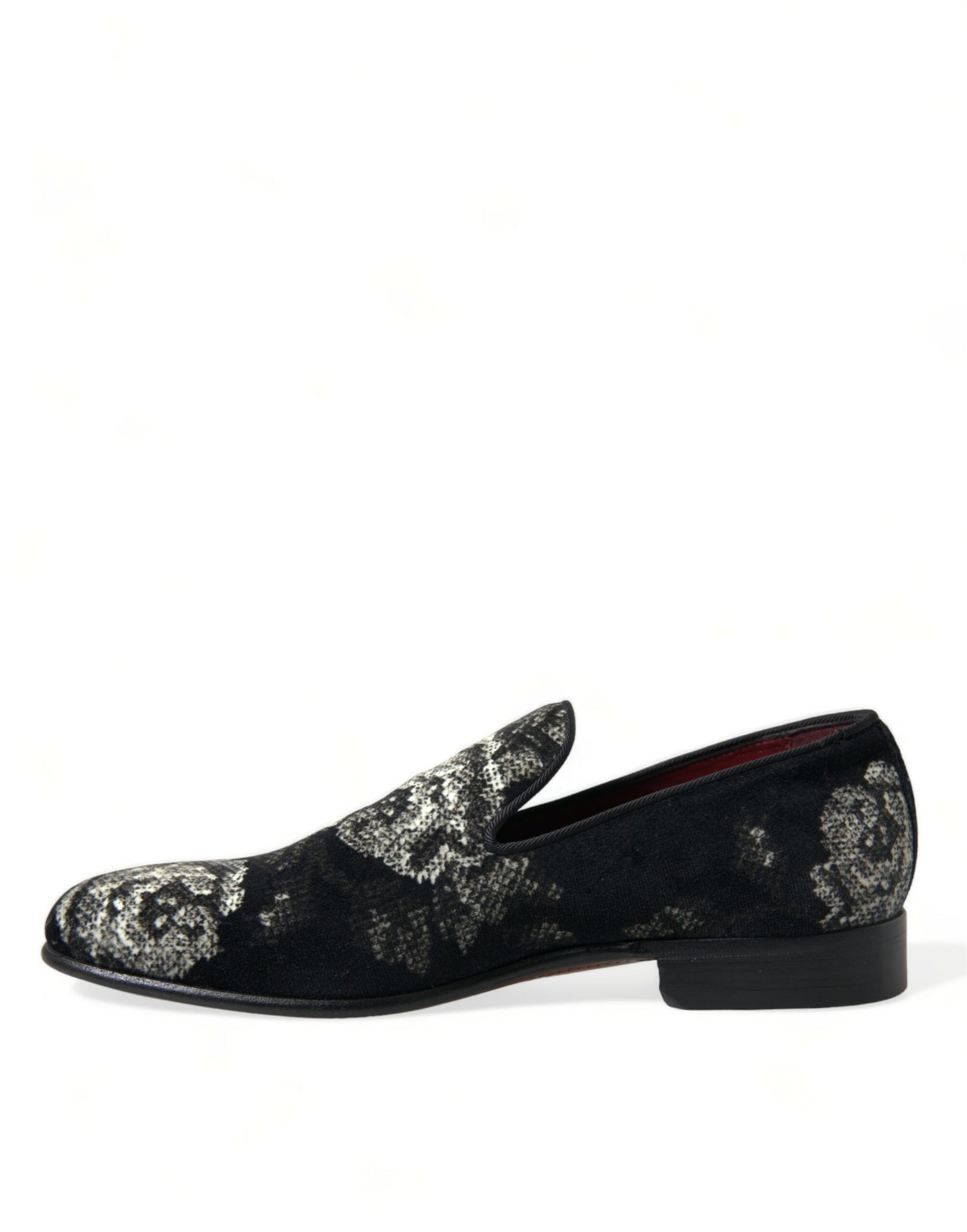 Pair of black velvet loafers with floral embroidery on top and heel