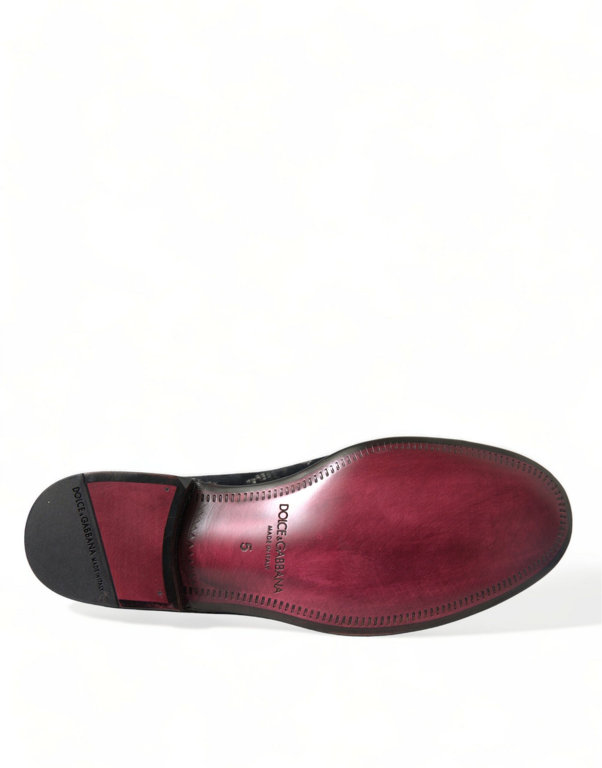 Red leather shoe with black sole and laces