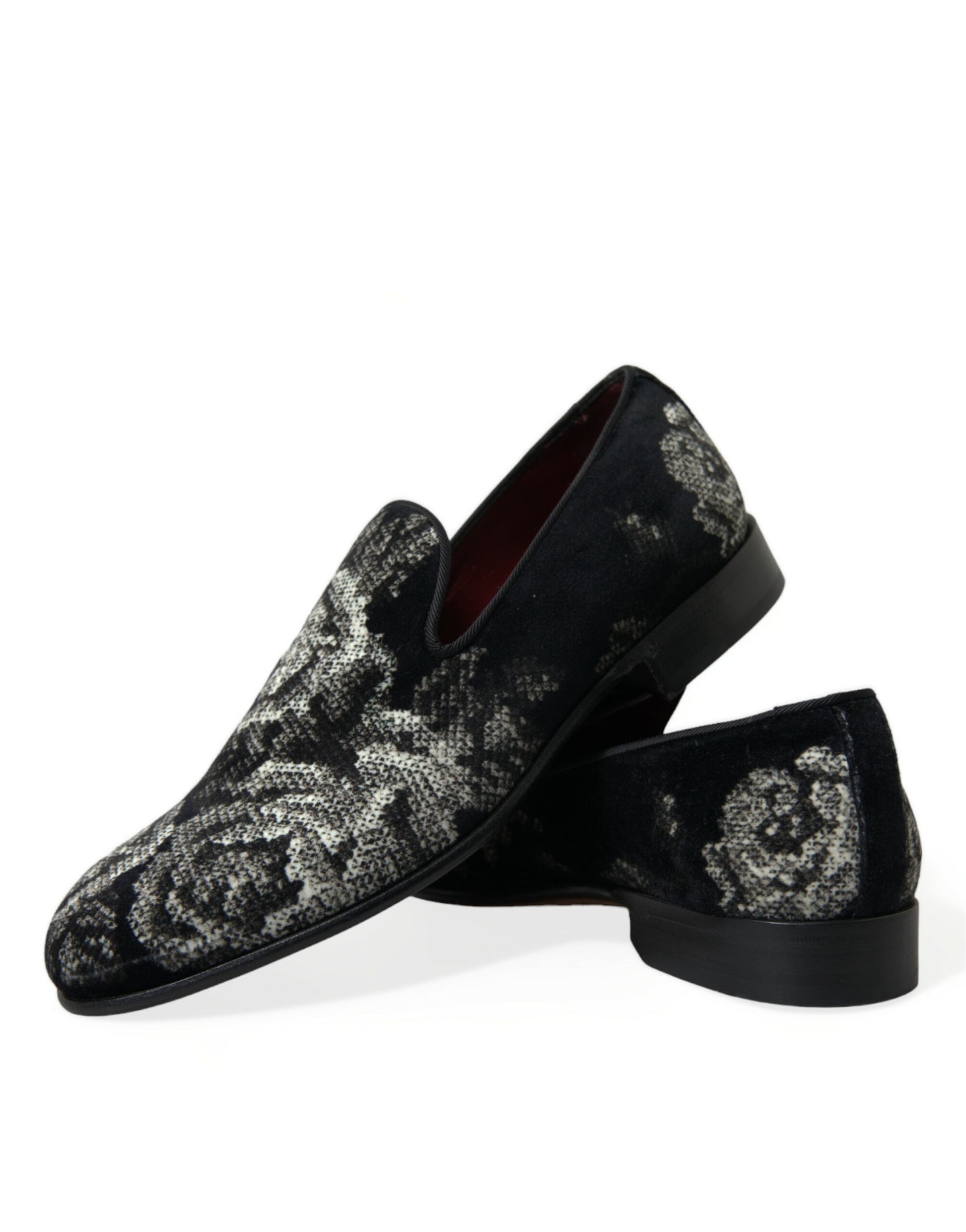 Pair of black loafers with white and gold floral pattern on top
