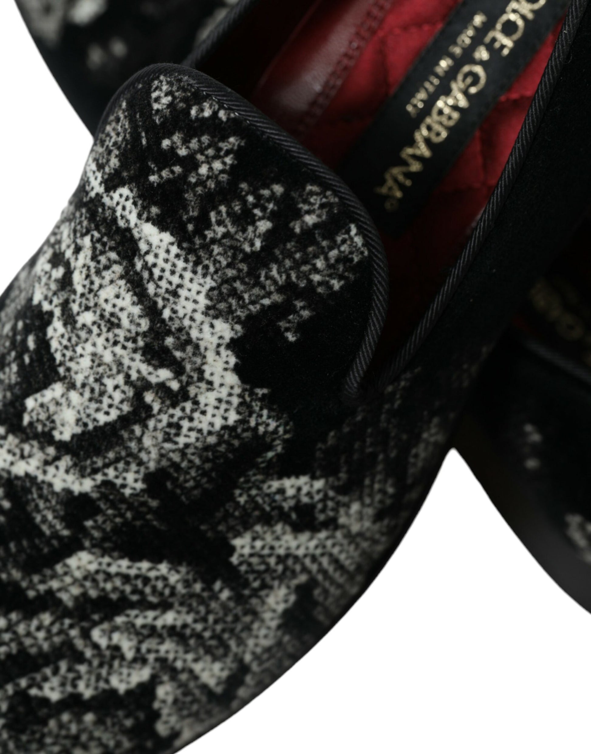 A shoe with a patterned upper and a bow on top