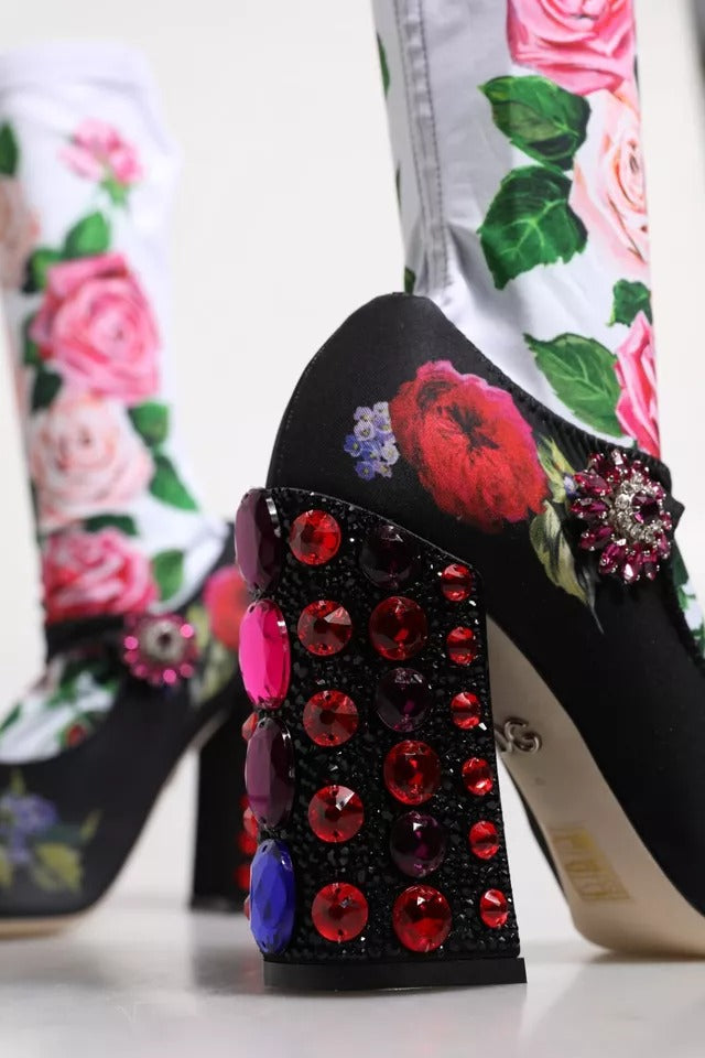 Black high heel shoe with floral print, red stones, and pink jewels