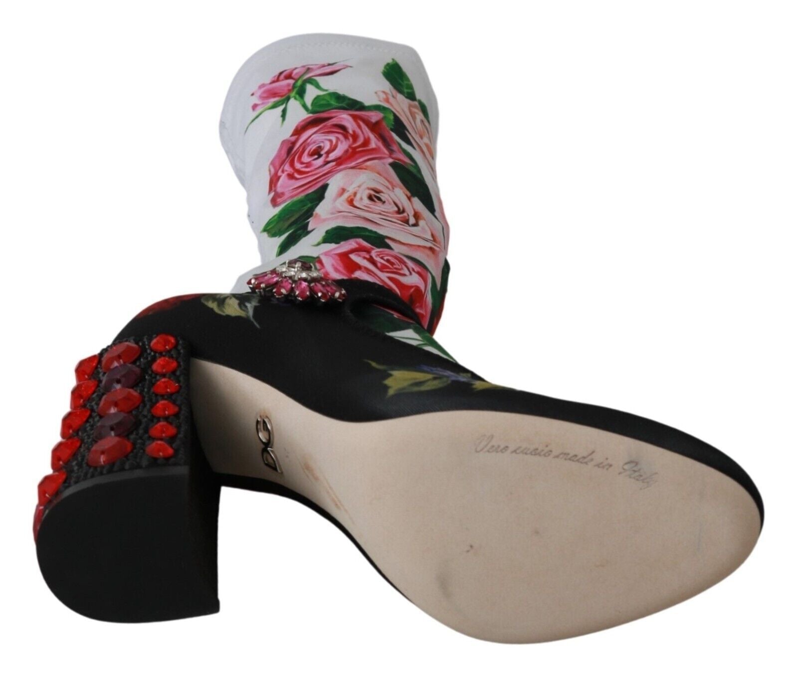 Pair of black high heel shoes with floral pattern and red embellishments