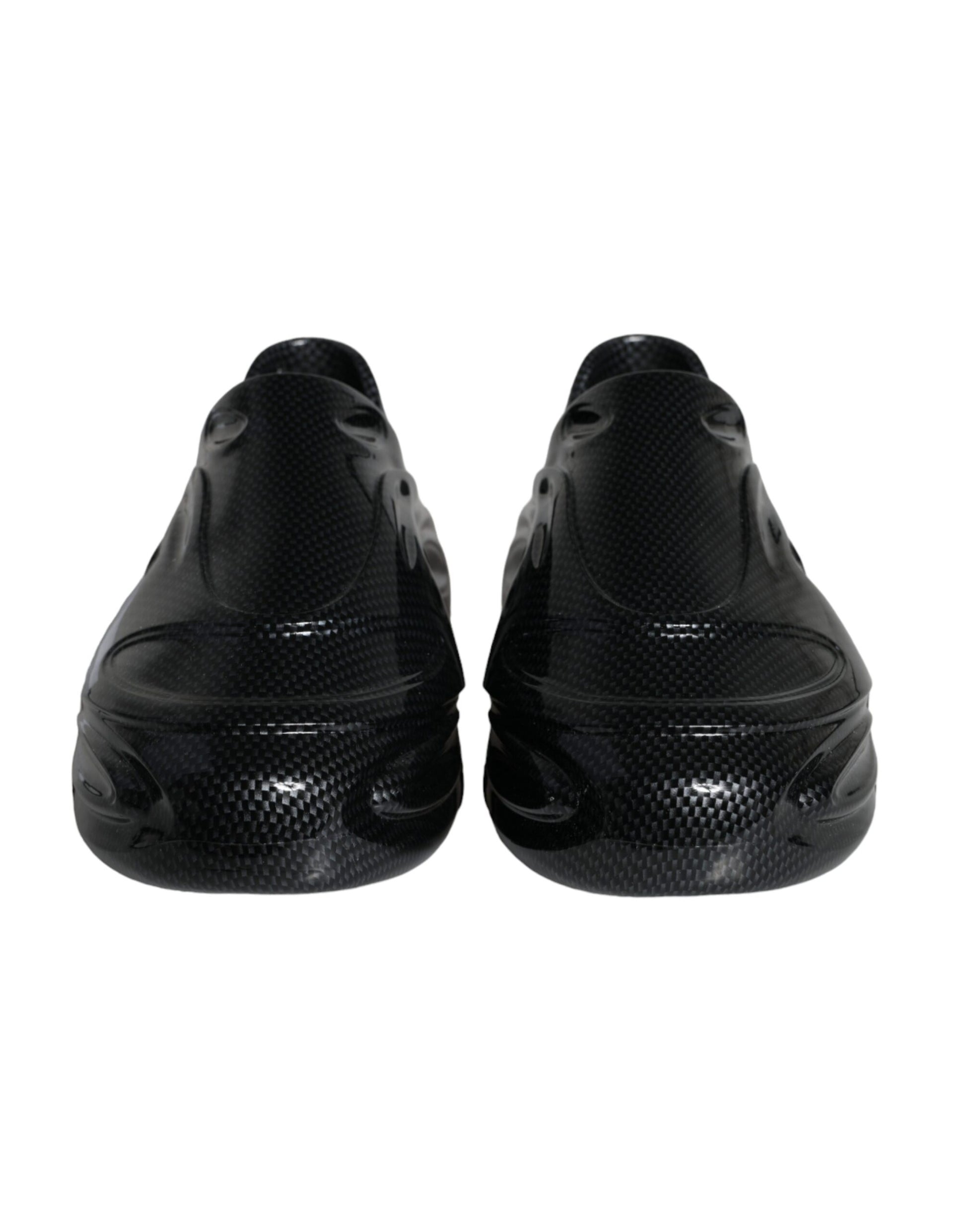 Pair of black athletic shoes with a patterned design on the side