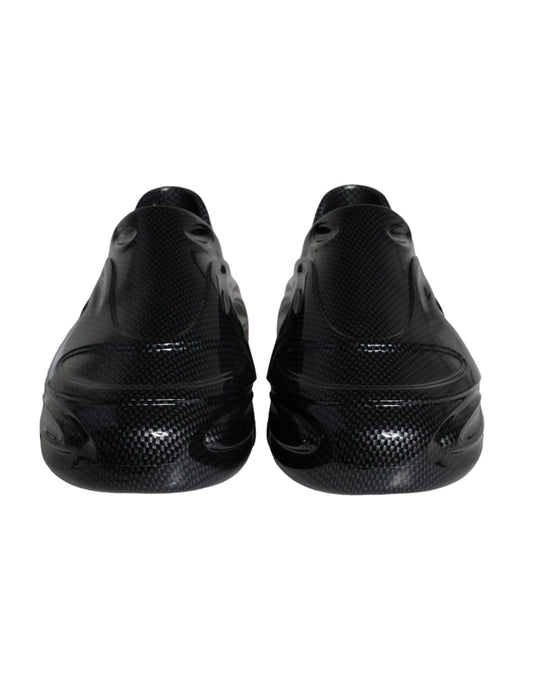 Pair of black athletic shoes with a patterned design on the side