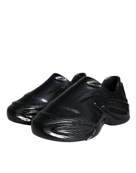 Pair of black ballet flats with a glossy finish