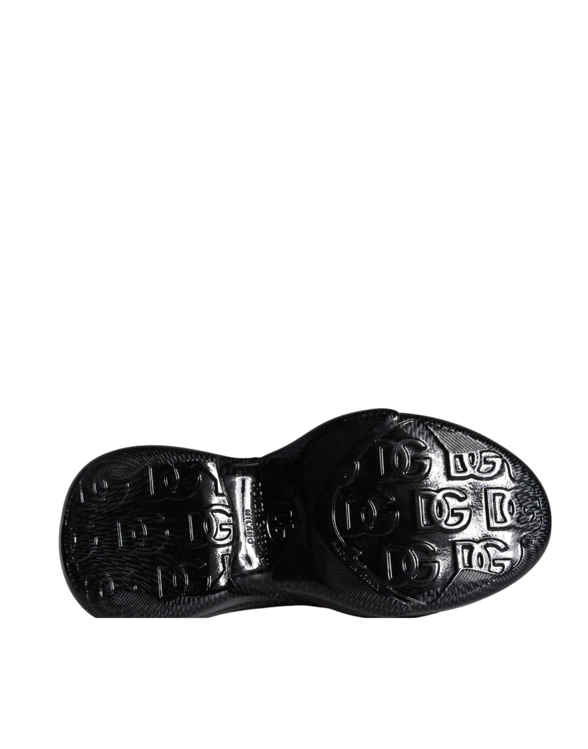 Black shoe with white sole and text on bottom