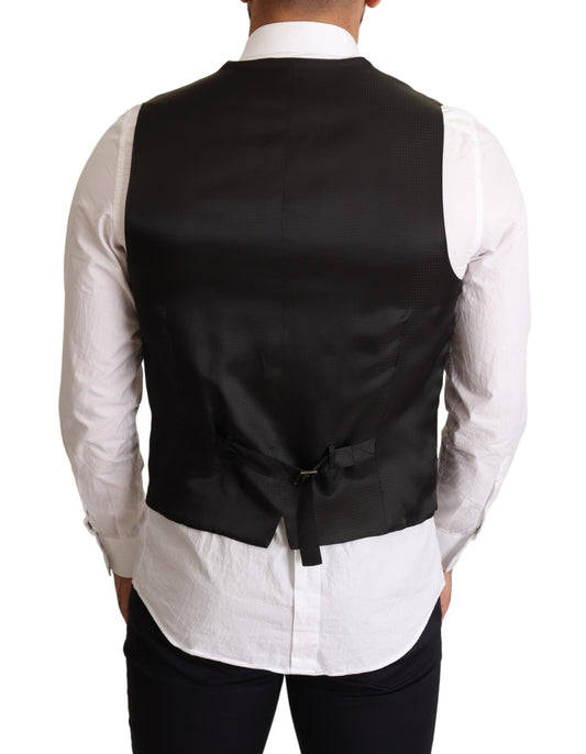 A black vest with a bow tie detail, part of formal wear from Dolce & Gabbana