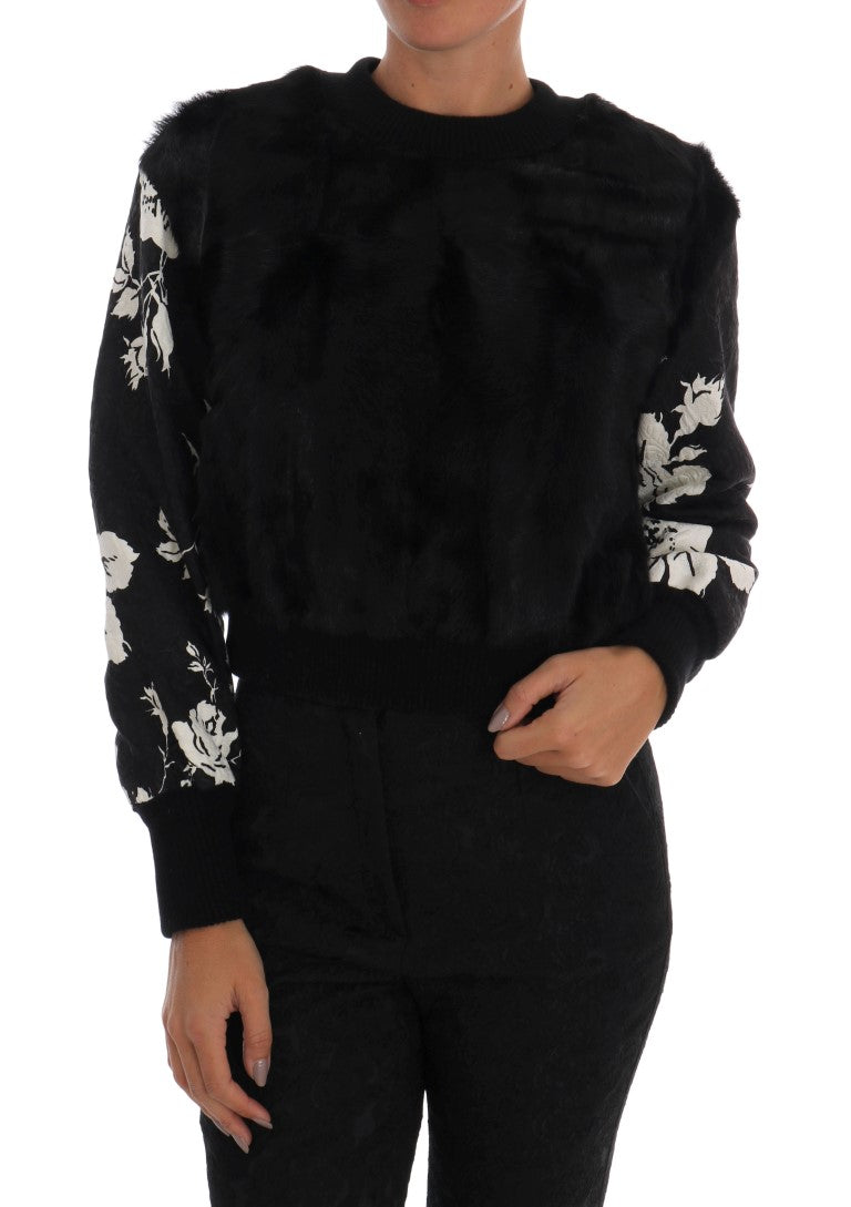 Black velvet jumpsuit with white floral pattern on sleeves