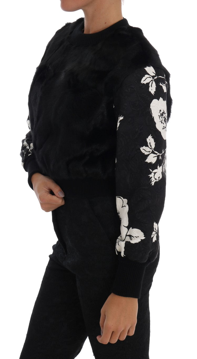 Black long sleeve sweater with floral pattern on front