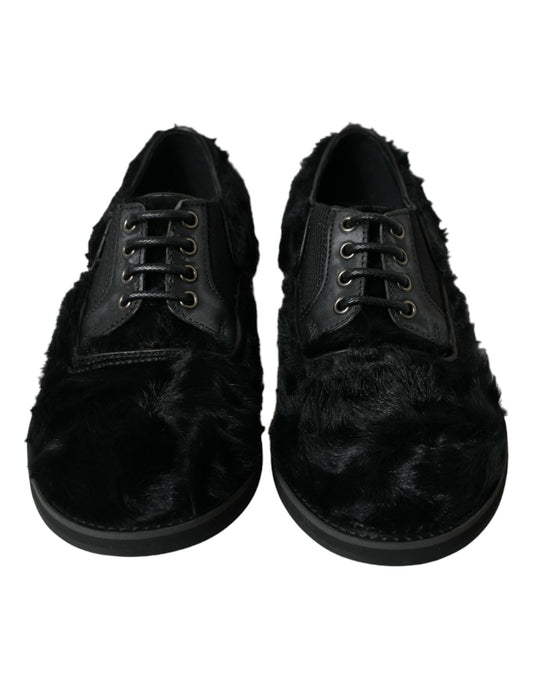 Pair of black velvet shoes with fur trim and laces