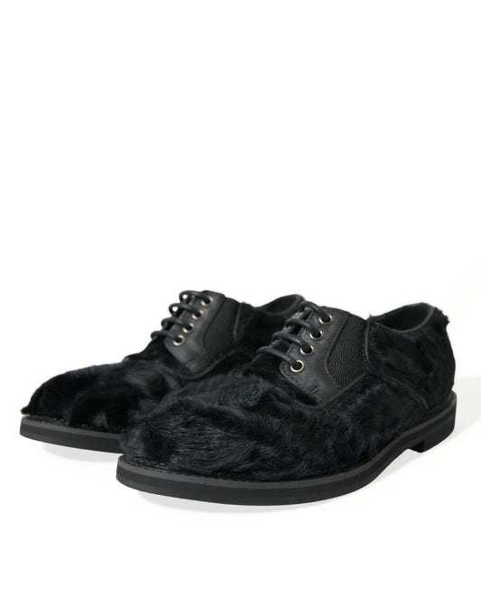 Pair of black velvet shoes with laces and buckles