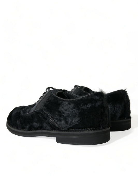 Pair of black velvet shoes with a furry texture on the upper part