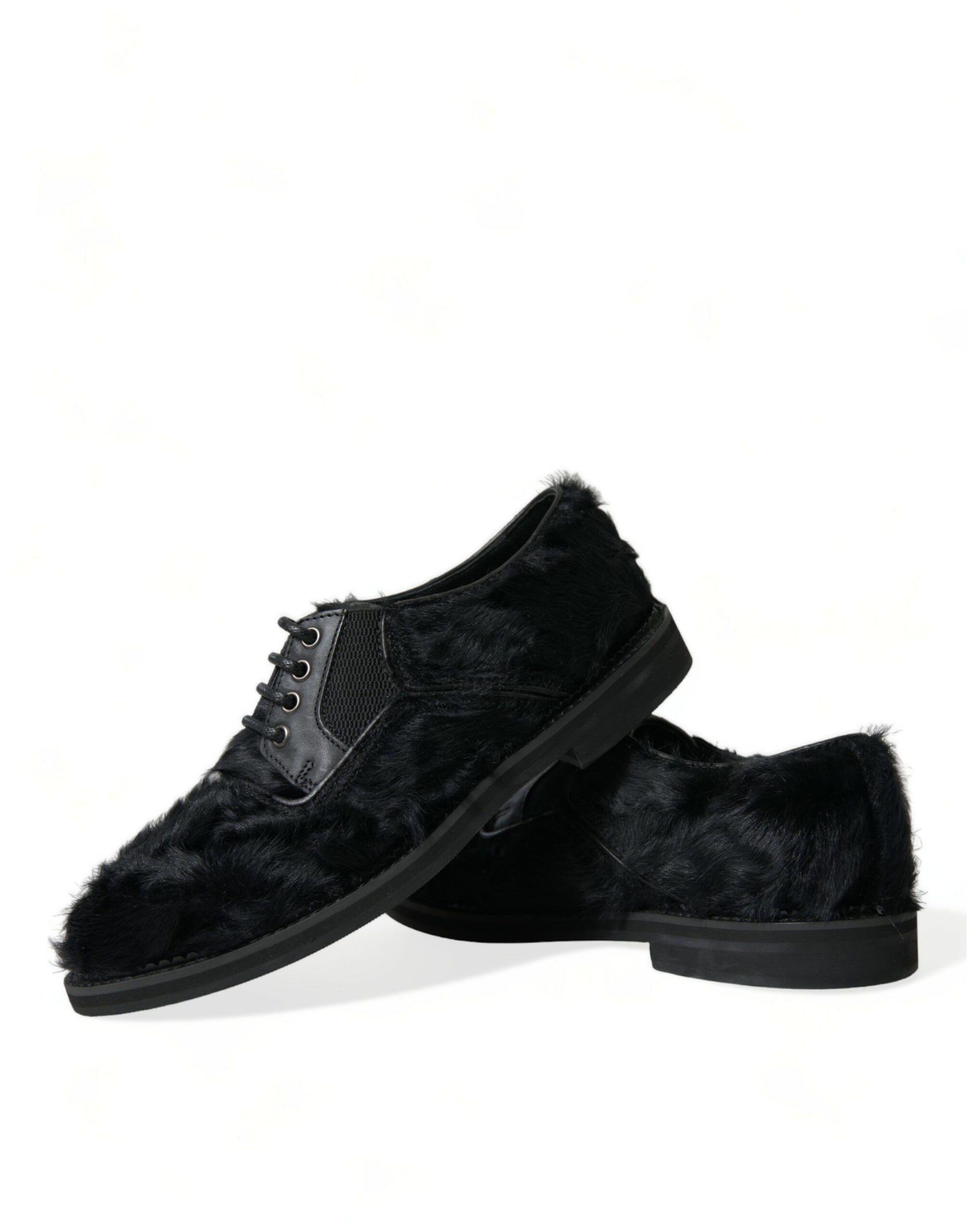 Pair of black velvet shoes with fur trim and laces
