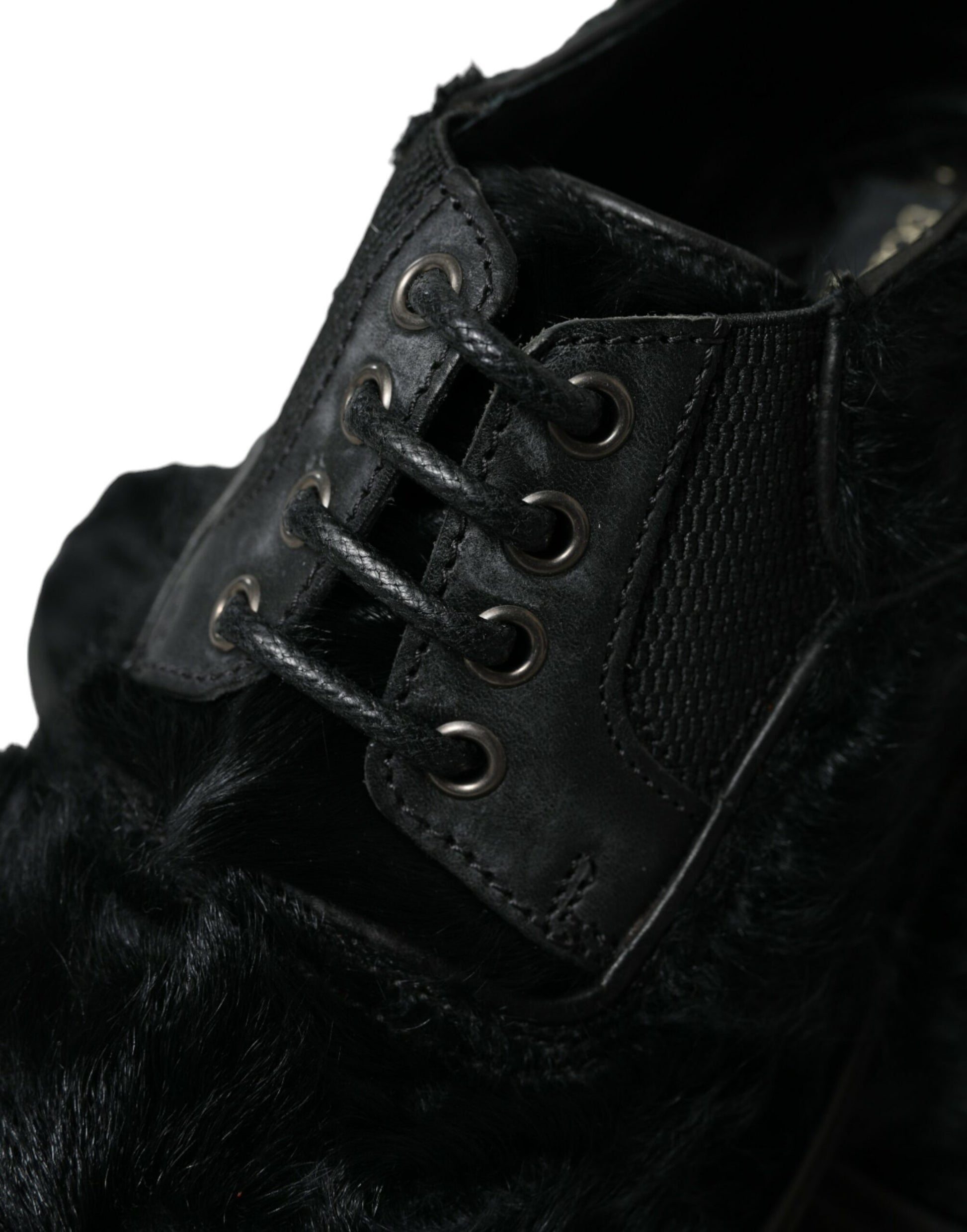 Black fur lined boots with lace up front and metal eyelets