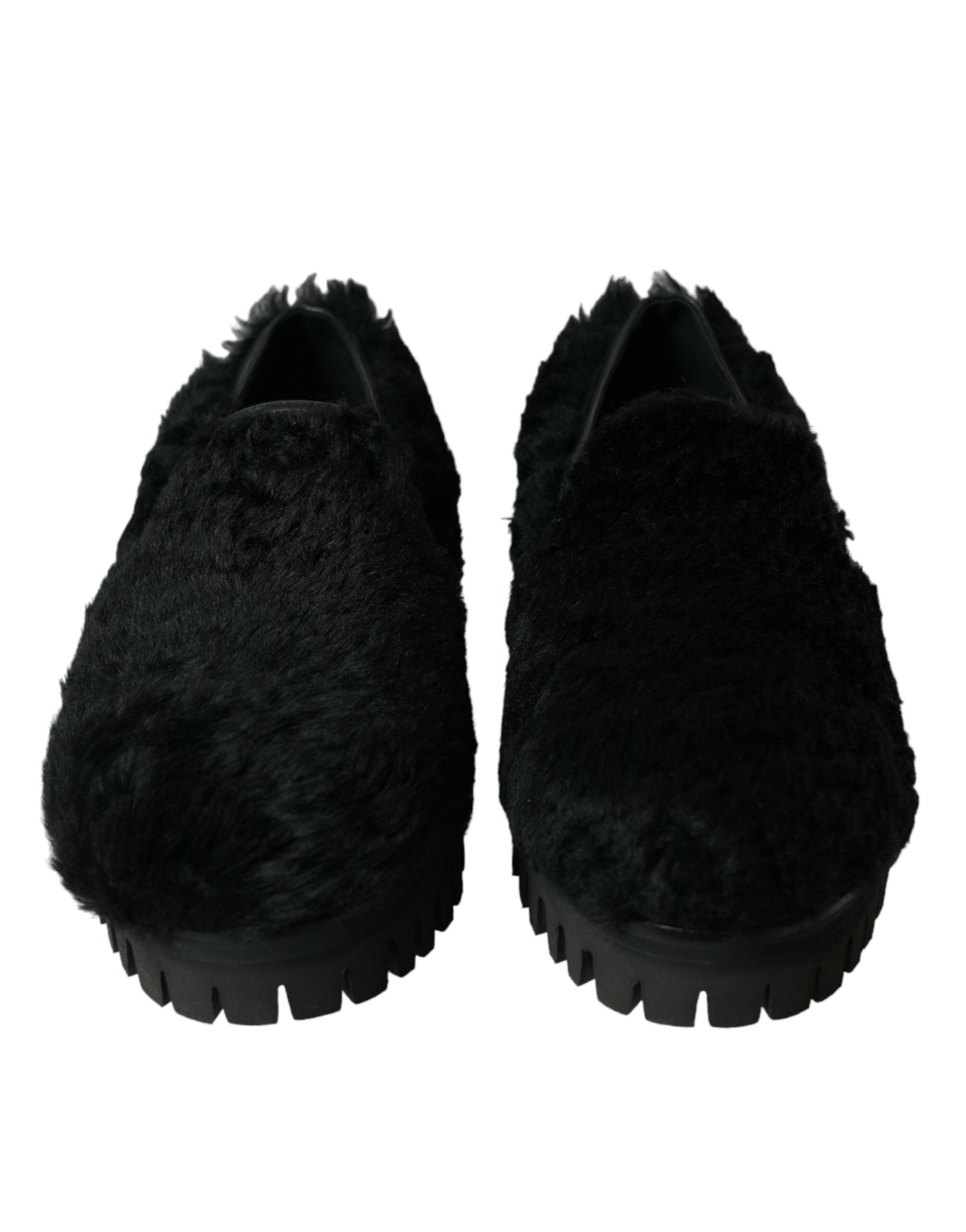 Pair of black slippers with fur trim and soles