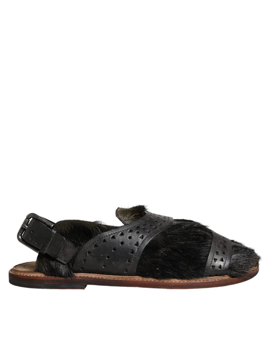 Pair of black sandals with brown straps