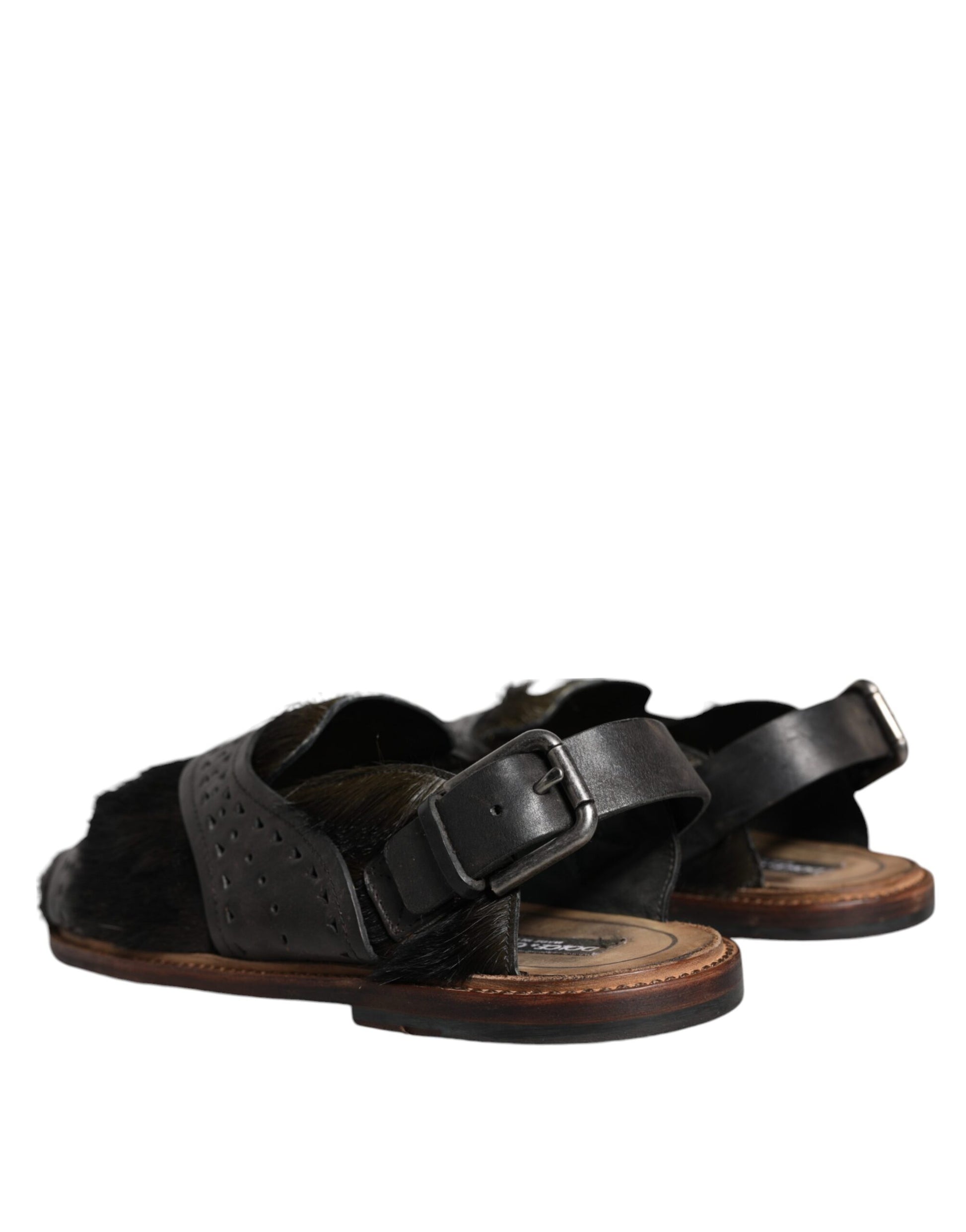 Pair of brown leather sandals with black straps