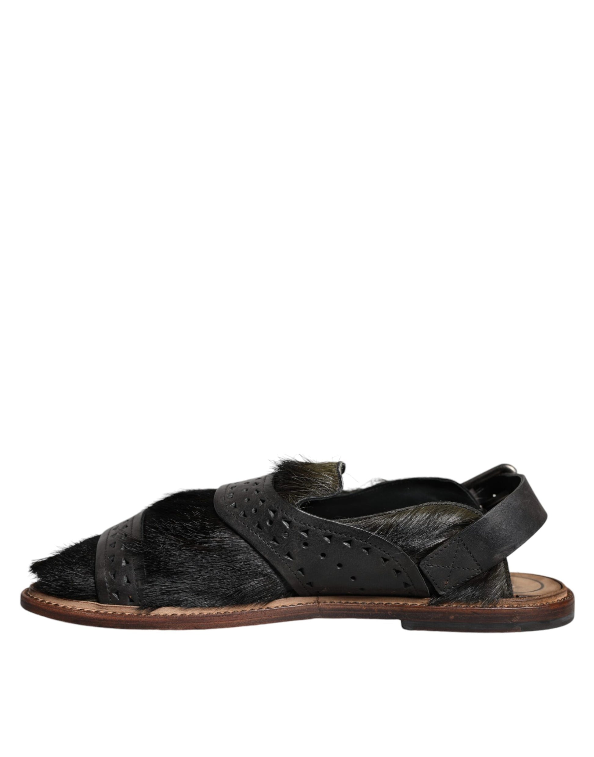 Black leather sandal with strap over foot