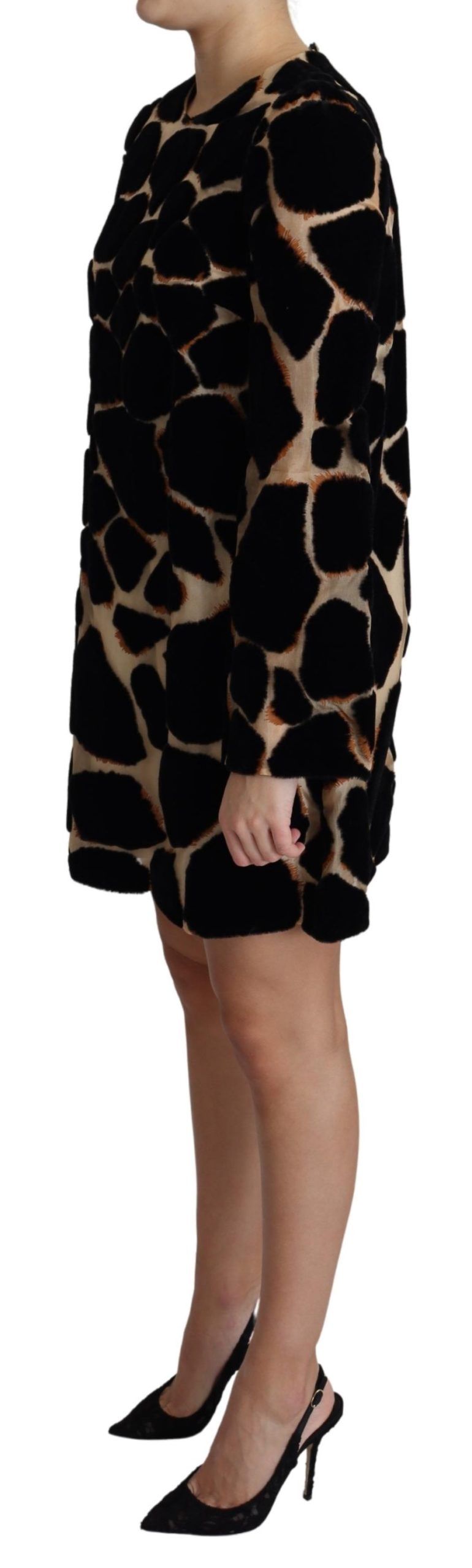 A black giraffe print shift mini dress with short sleeves and a knee-length skirt