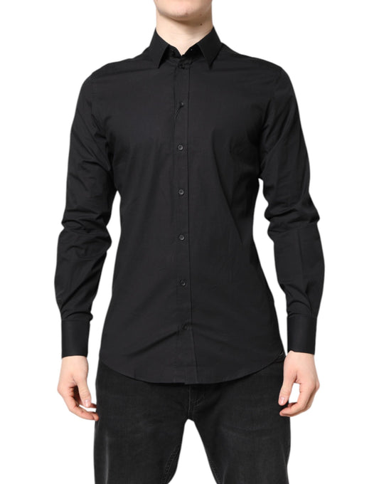 A black dress shirt with gold accents, part of a formal wear collection by Dolce & Gabbana