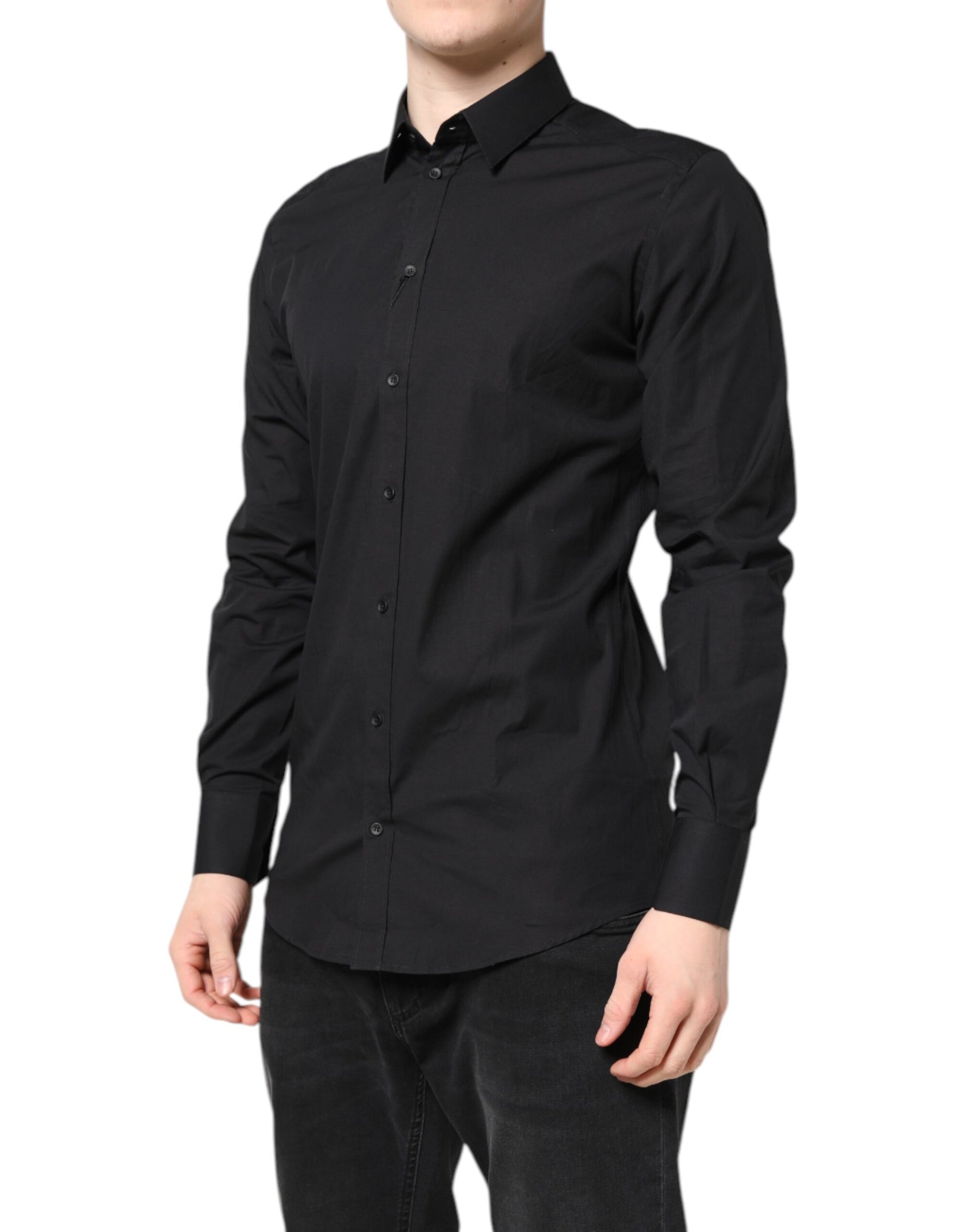 A black dress shirt with gold accents, part of a formal wear collection by Dolce & Gabbana
