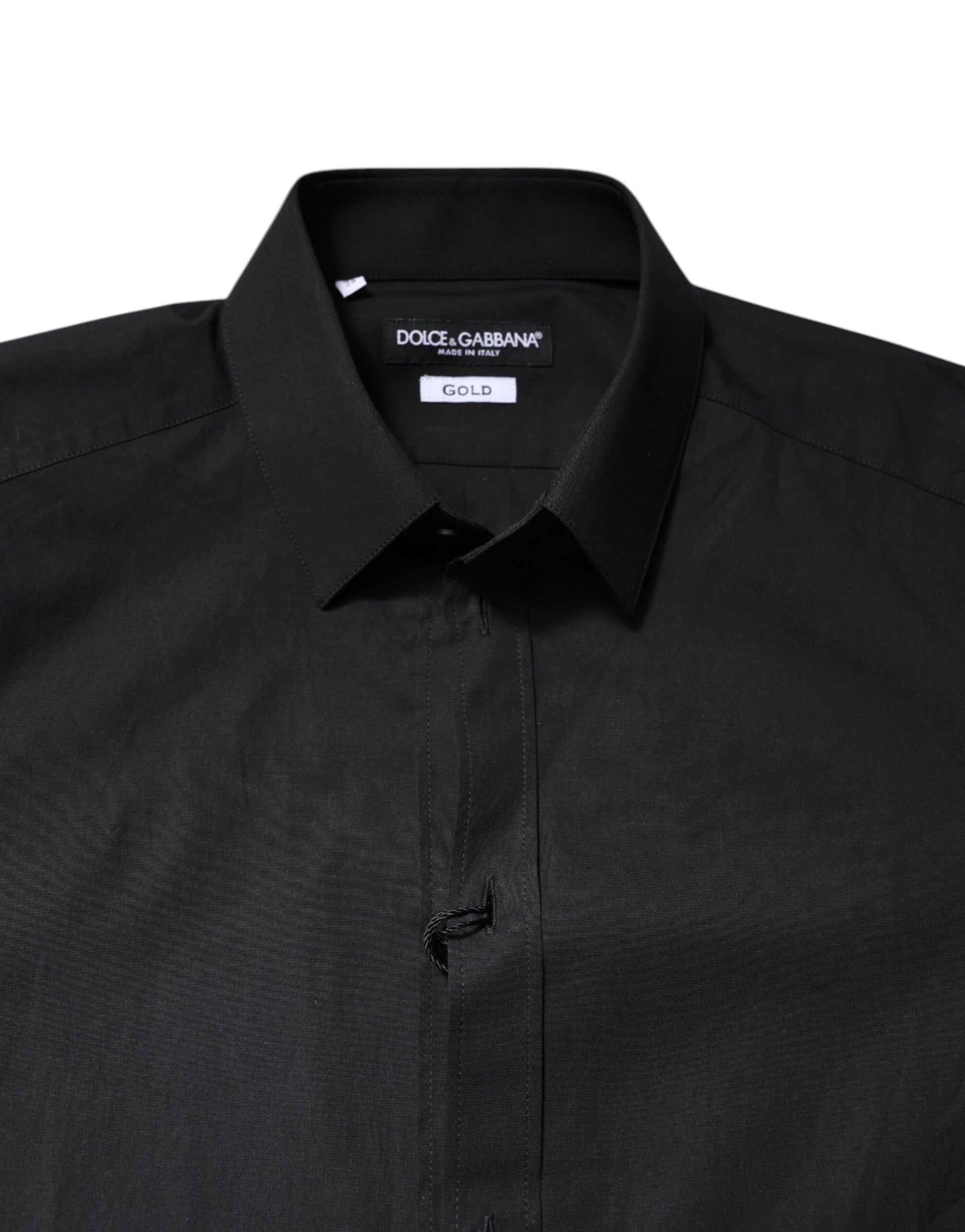 A black dress shirt with gold accents from Dolce & Gabbana, featuring a collar and button-up front