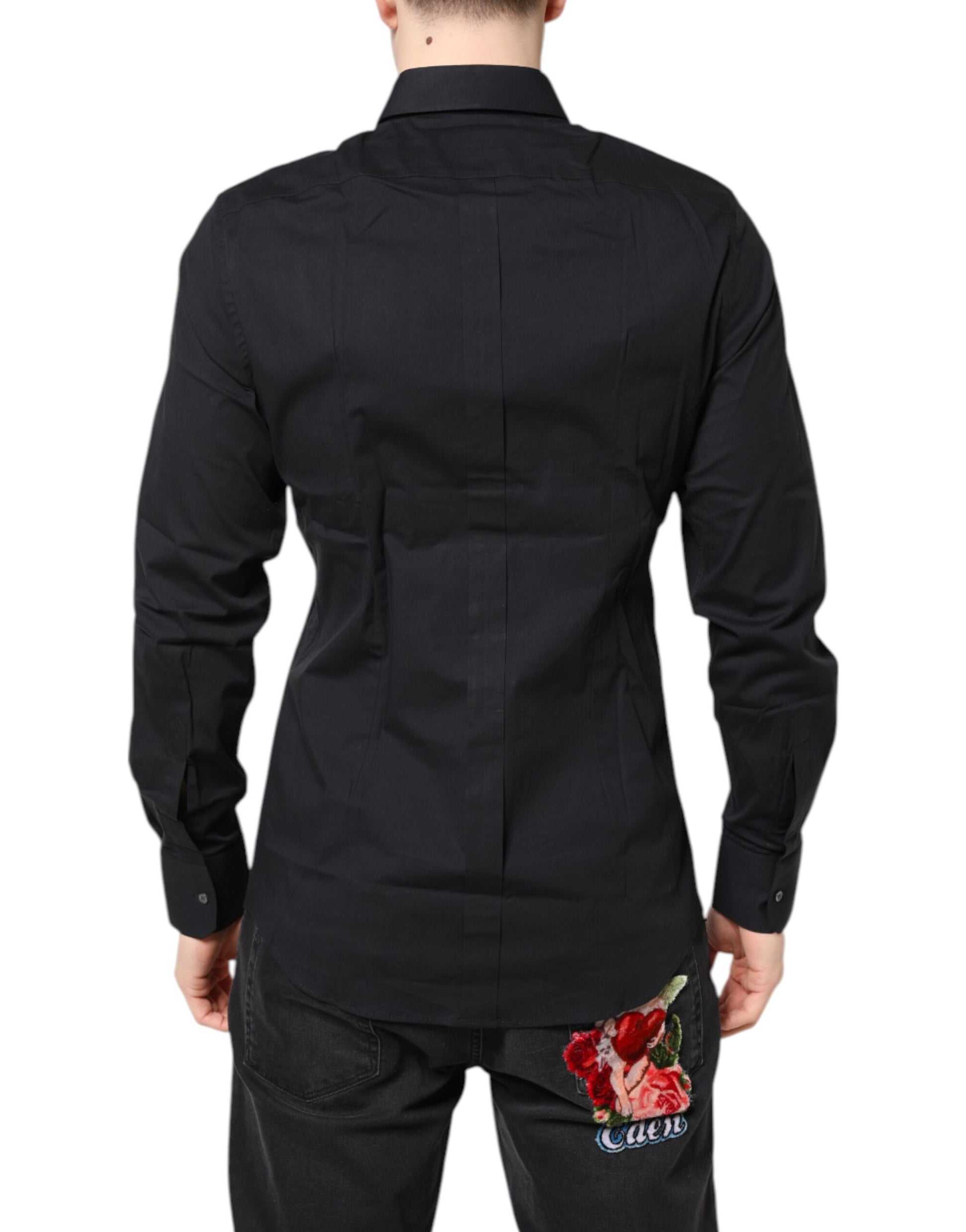 A black dress shirt with gold accents and a rose embroidered on the back