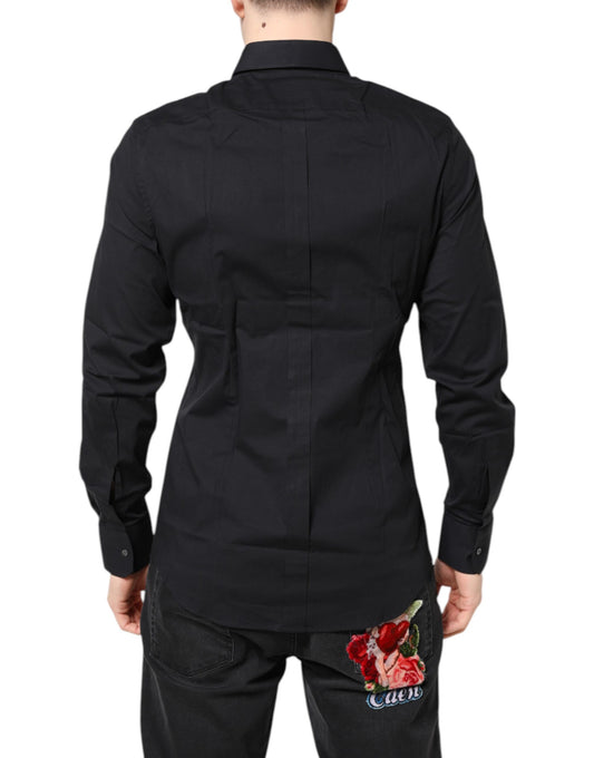 A black dress shirt with gold accents and a rose embroidered on the back