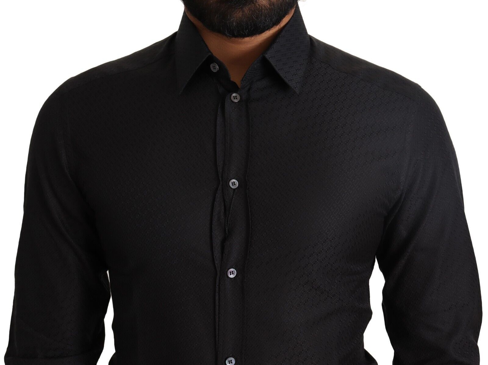 A black dress shirt with gold buttons, part of a formal wear collection by Dolce & Gabbana