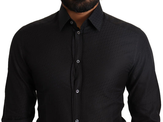 A black dress shirt with gold buttons, part of a formal wear collection by Dolce & Gabbana