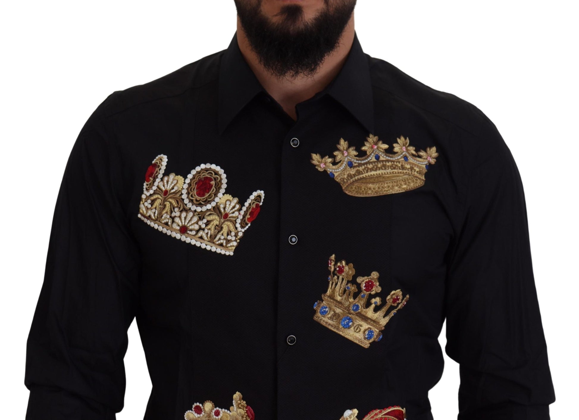 A black dress shirt with gold crowns embroidered on the chest and sleeves