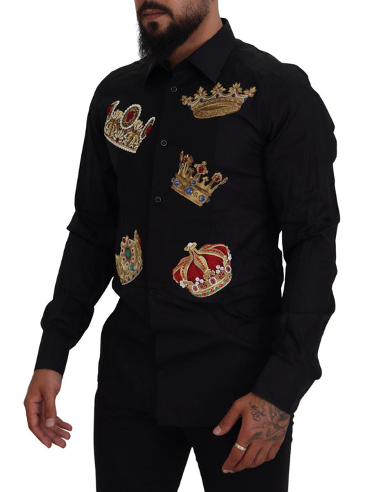 A black dress shirt with gold crowns embroidered on the front