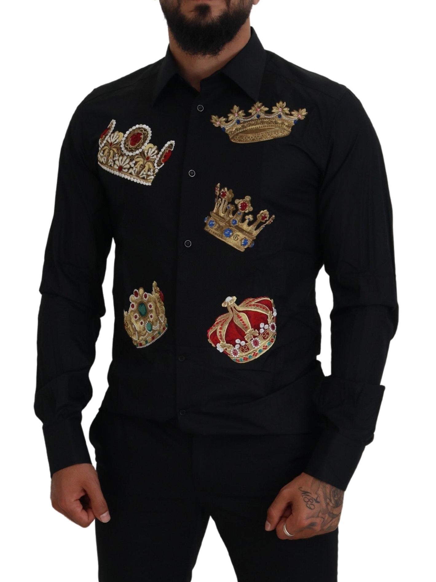 A black dress shirt with gold crowns embroidered on the front
