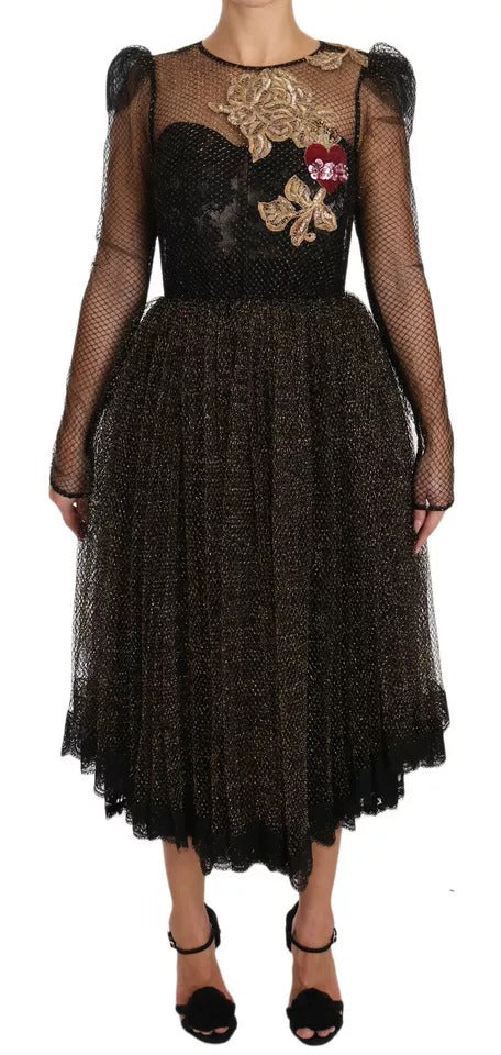 Long black dress with gold crystals and heart embellishment on bodice