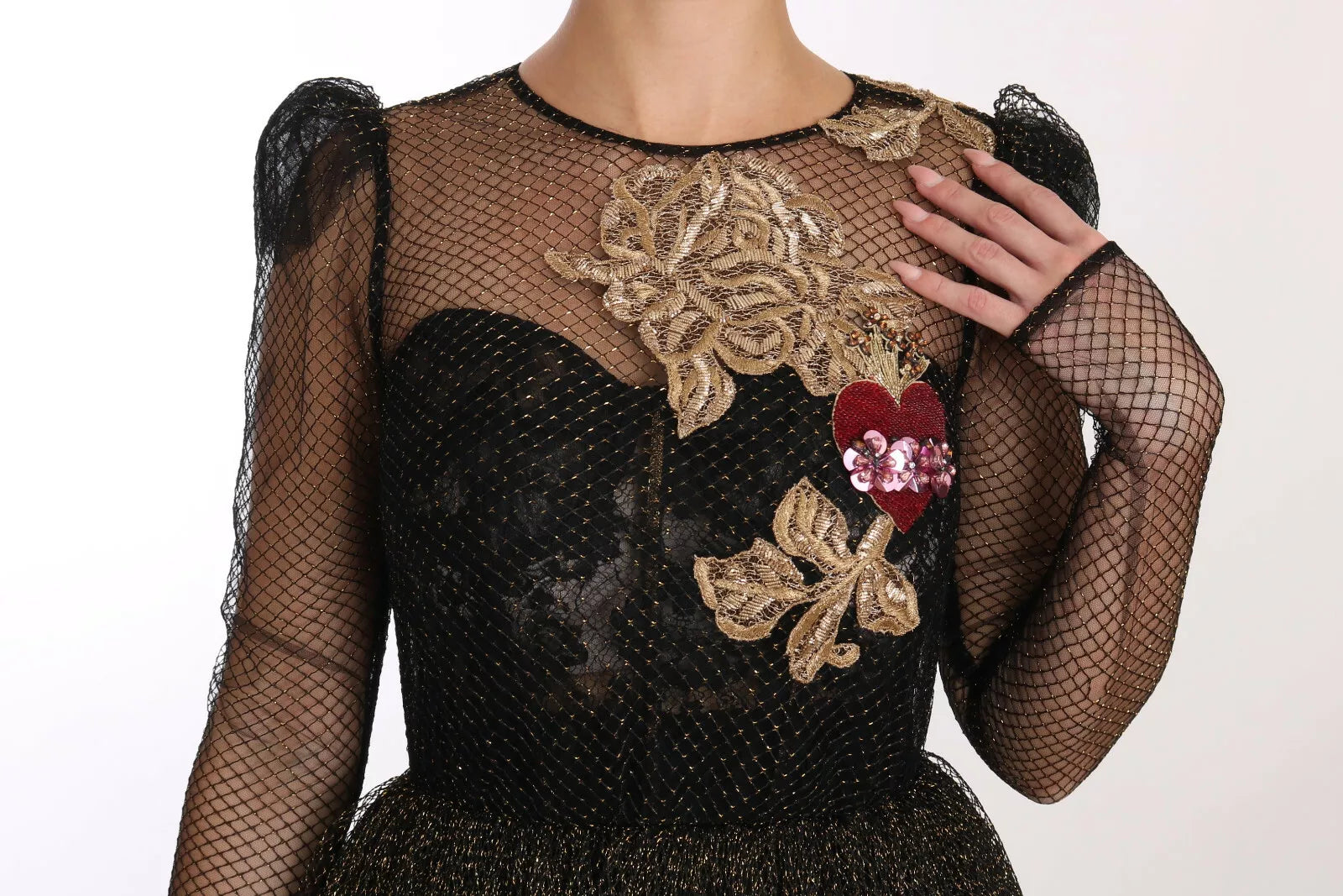 A black gold crystal heart embellished a-line dress from Dolce & Gabbana