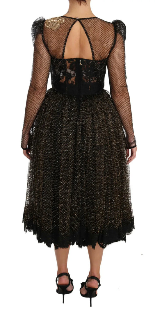 A black dress with gold crystals and a heart design on the back