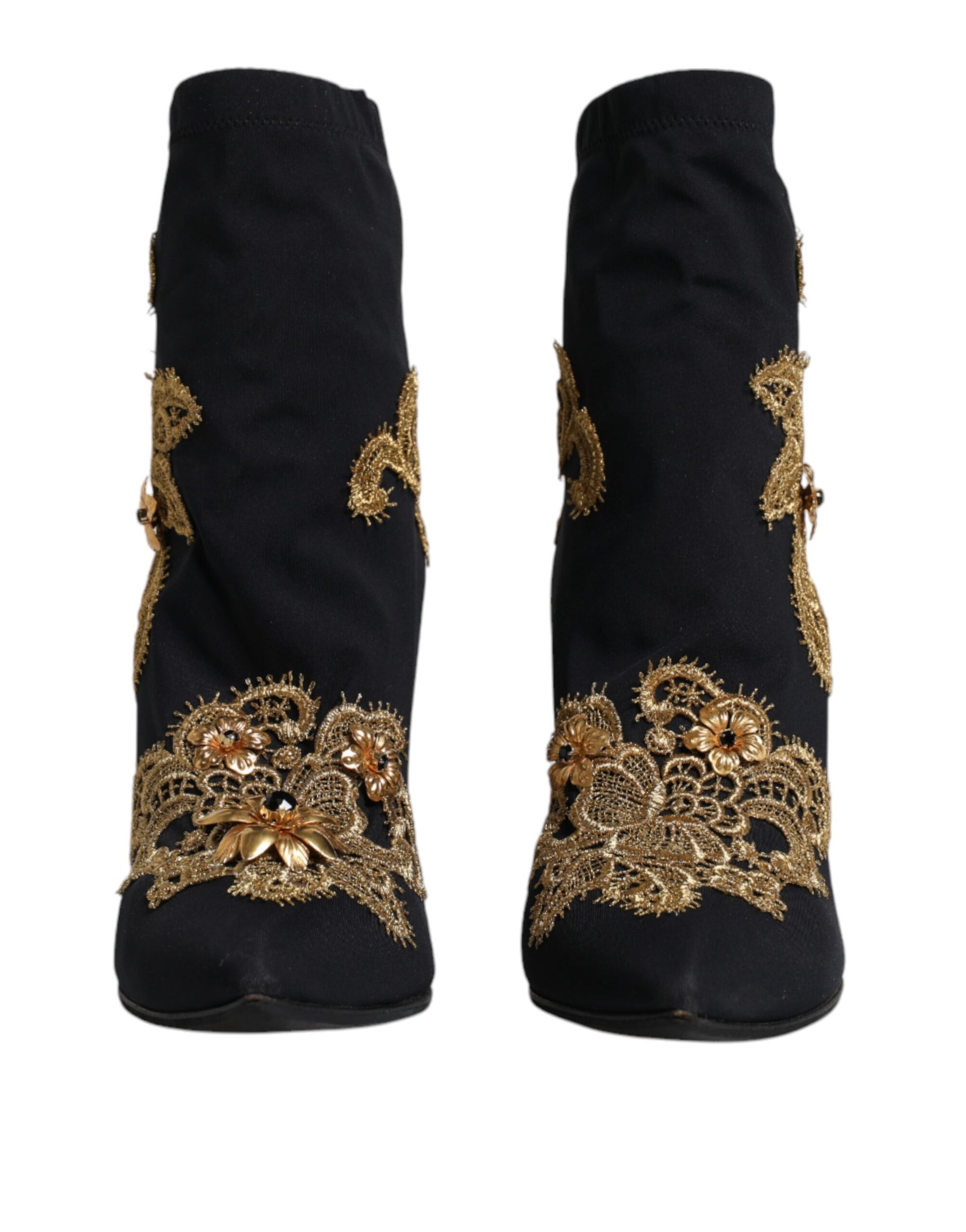 Pair of black boots with gold embroidery on sides
