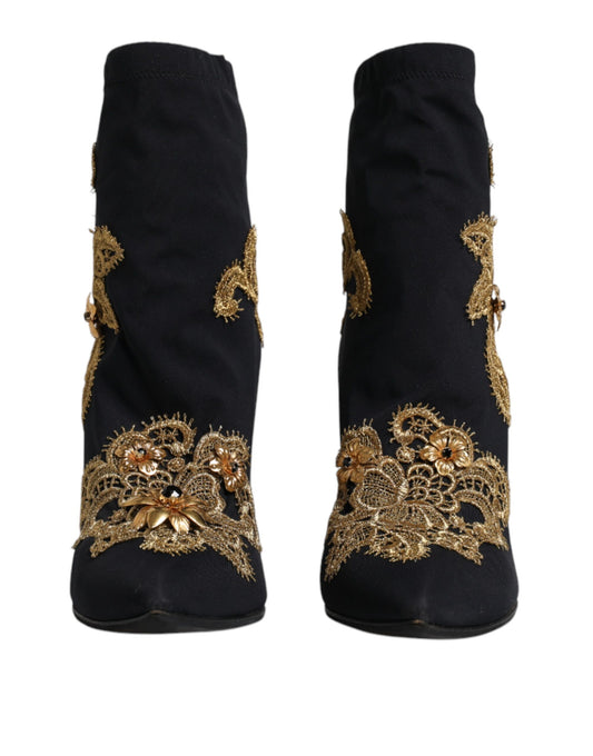 Pair of black boots with gold embroidery on sides
