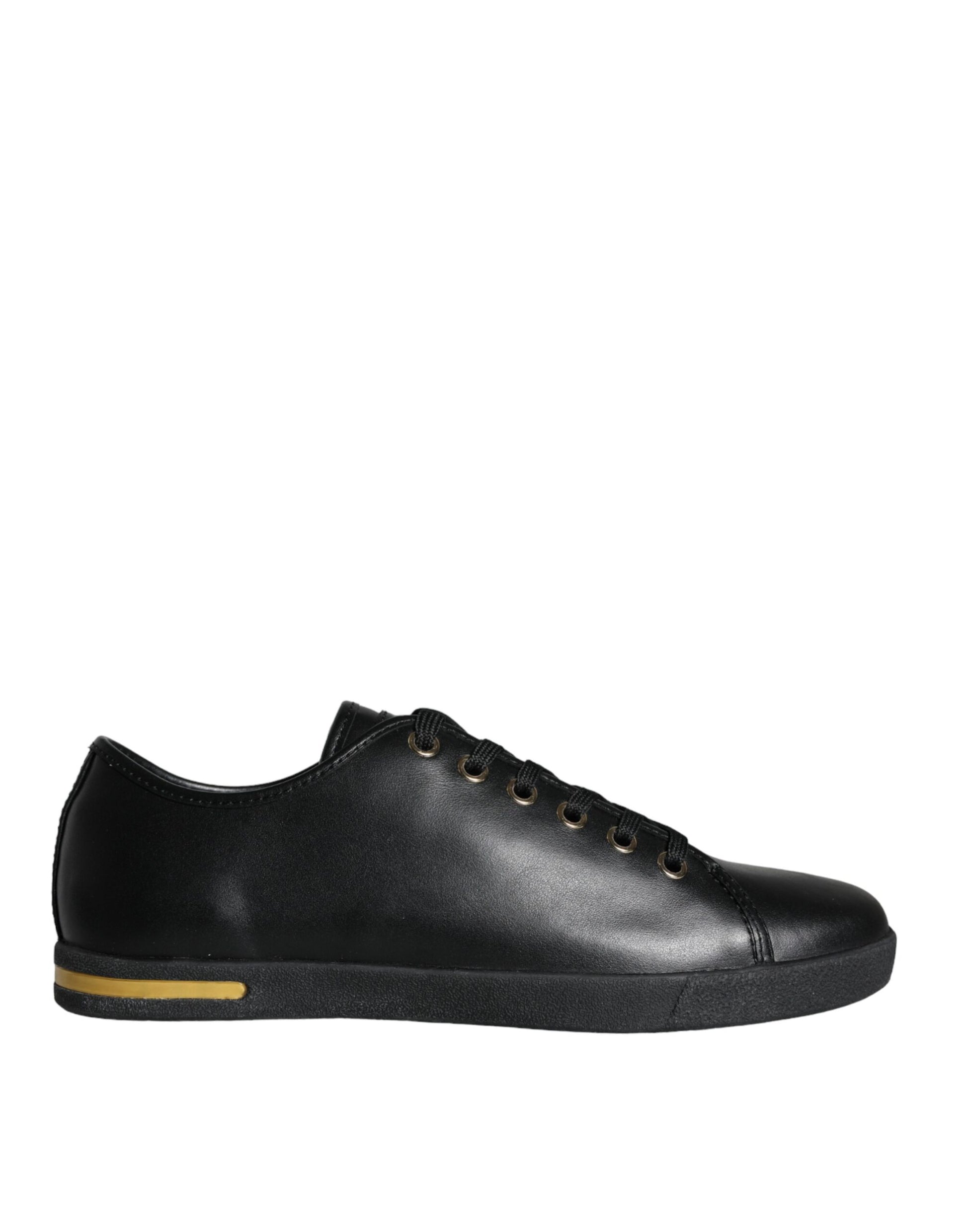 Black sneaker with yellow stripe on side and black laces